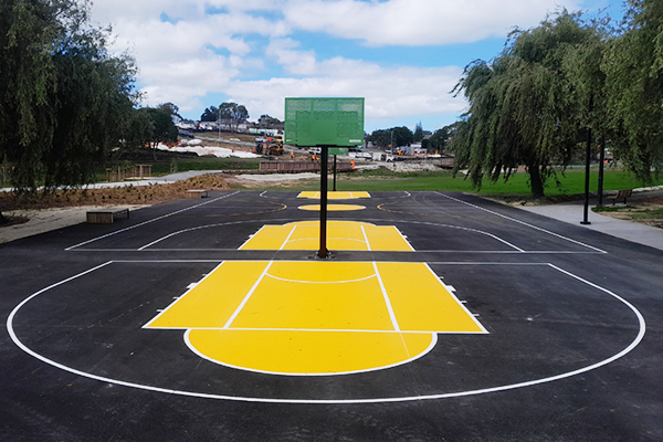 Basketball Court with painted white lines and coloured sections